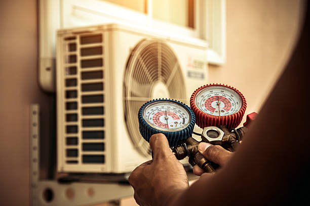 Professional Heat Pump Repair technician working in North Grafton, MA